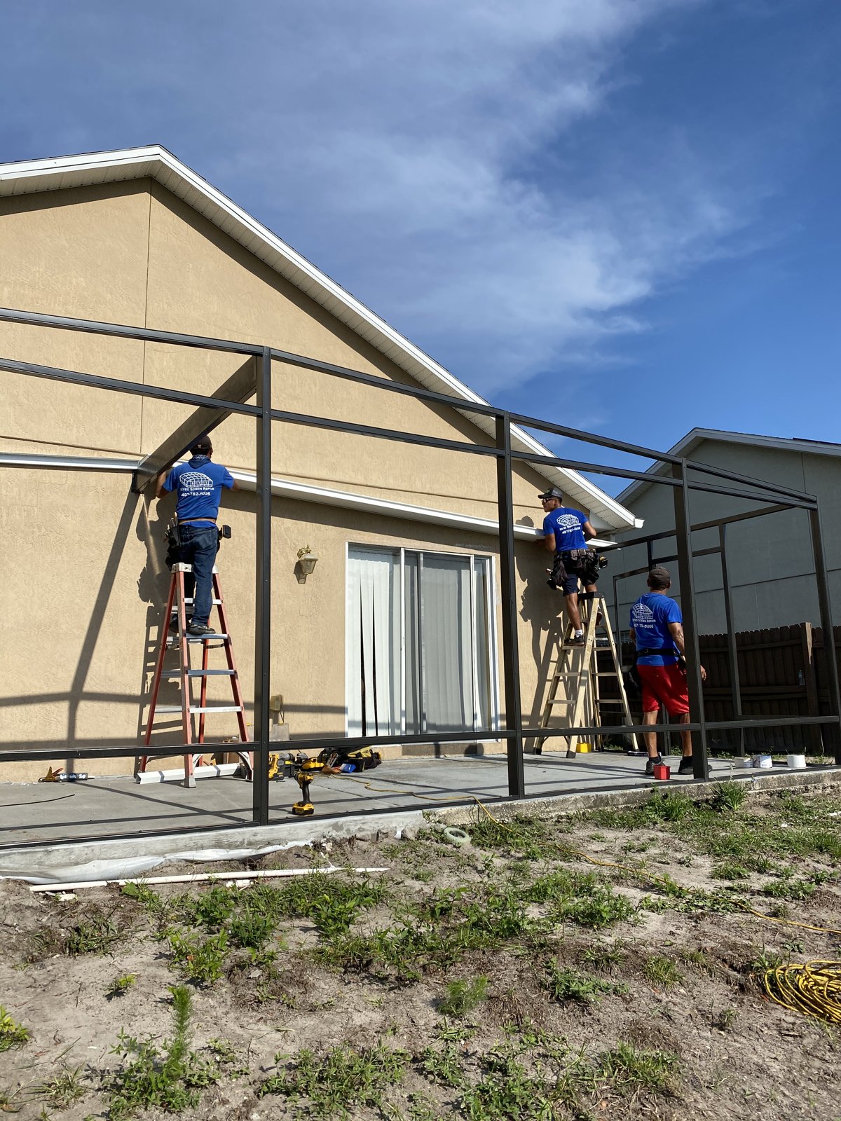 RSR crew building screen enclosure